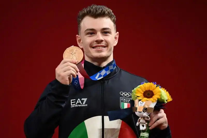 La terza medaglia è quella più sorprendente: l'ha conquistata Mirko Zanni, bronzo nel sollevamento pesi, categoria 67 kg