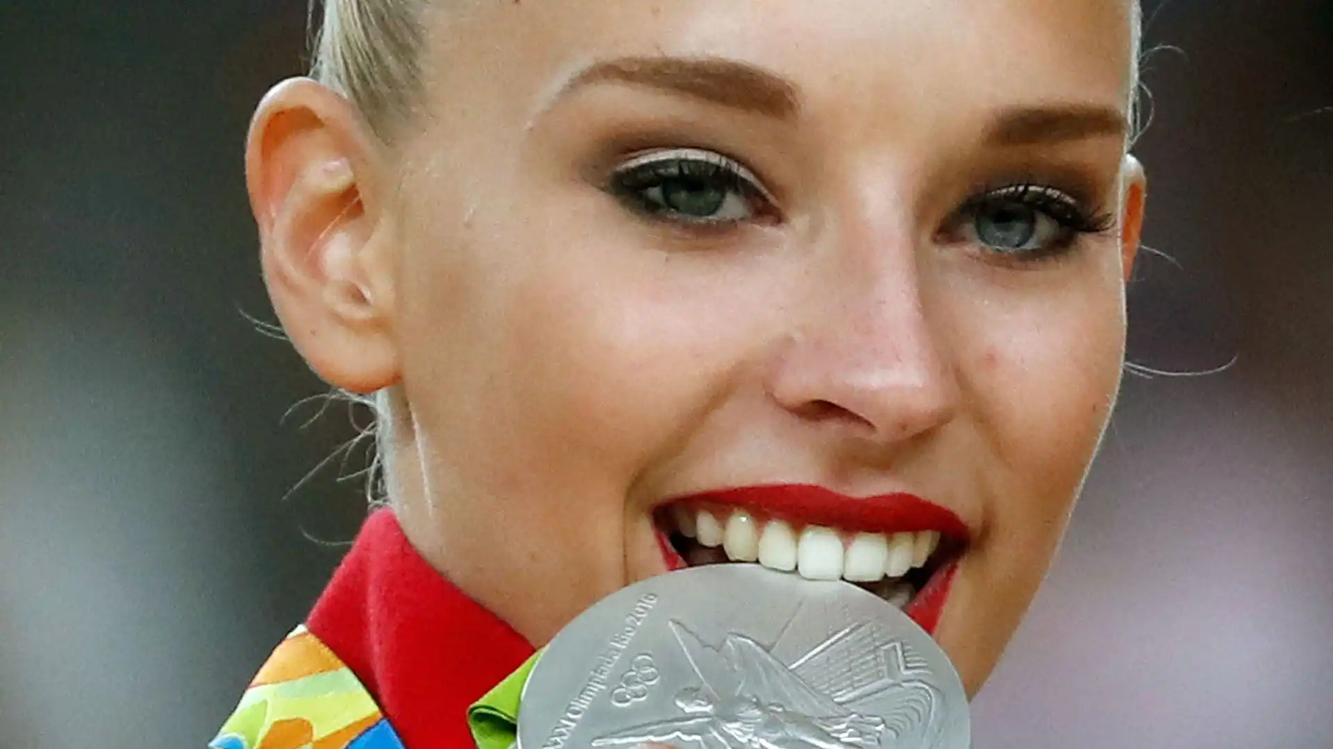 È la più giovane ginnasta ad avere vinto i mondiali di ginnastica ritmica, conquistando l'oro nella gara all-around a Kiev 2013 all'età di 15 anni